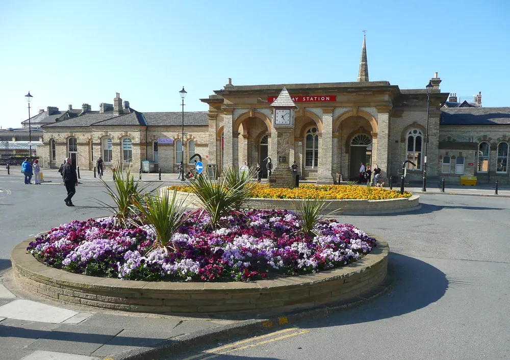 Floral roundabout and station building, Saltburn-by-the-Sea